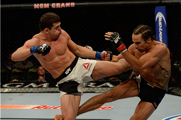 LAS VEGAS, NV - JULY 12: (L-R) Caio Magalhaes kicks Josh Samman in their middleweight bout during the Ultimate Fighter Finale inside MGM Grand Garden Arena on July 12, 2015 in Las Vegas, Nevada. (Photo by Brandon Magnus/Zuffa LLC/Zuffa LLC via Getty Ima