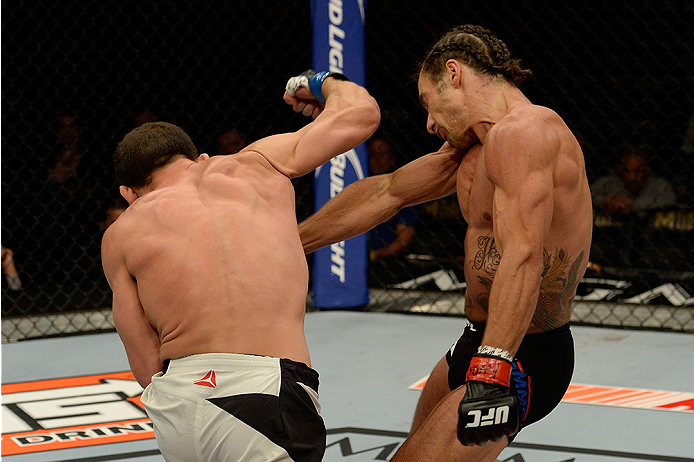 LAS VEGAS, NV - JULY 12: (L-R) Caio Magalhaes punches Josh Samman in their middleweight bout during the Ultimate Fighter Finale inside MGM Grand Garden Arena on July 12, 2015 in Las Vegas, Nevada. (Photo by Brandon Magnus/Zuffa LLC/Zuffa LLC via Getty I