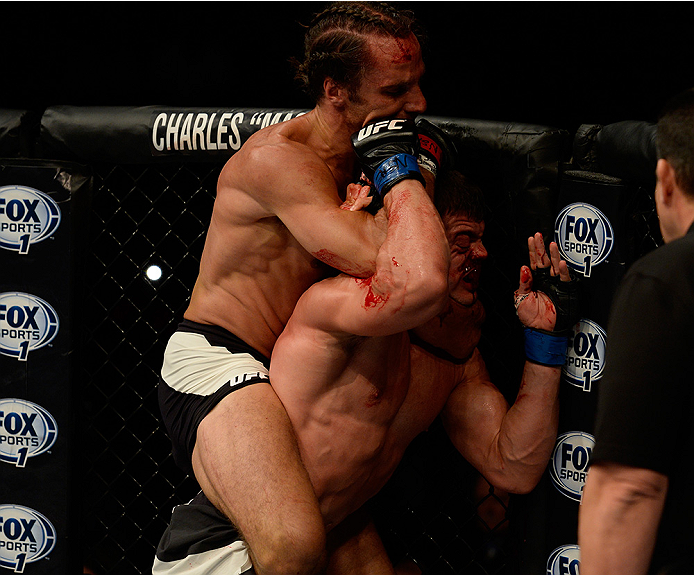 LAS VEGAS, NV - JULY 12: (L-R) Josh Samman attempts a rear naked choke on Caio Magalhaes in their middleweight bout during the Ultimate Fighter Finale inside MGM Grand Garden Arena on July 12, 2015 in Las Vegas, Nevada. (Photo by Brandon Magnus/Zuffa LL