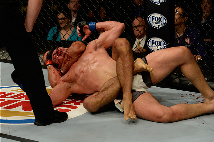 LAS VEGAS, NV - JULY 12: (Bottom) Josh Samman attempts a rear naked choke on Caio Magalhaes in their middleweight bout during the Ultimate Fighter Finale inside MGM Grand Garden Arena on July 12, 2015 in Las Vegas, Nevada. (Photo by Brandon Magnus/Zuffa