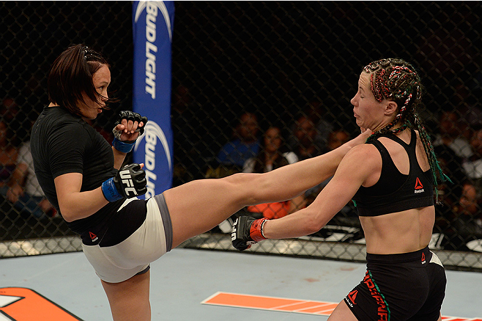 LAS VEGAS, NV - JULY 12: (L-R) Michelle Waterson kicks Angela Magana in their women's strawweight bout during the Ultimate Fighter Finale inside MGM Grand Garden Arena on July 12, 2015 in Las Vegas, Nevada. (Photo by Brandon Magnus/Zuffa LLC/Zuffa LLC v