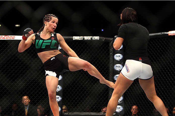 LAS VEGAS, NV - JULY 12: (L-R) Angela Magana kicks Michelle Waterson in their women's strawweight bout during the Ultimate Fighter Finale inside MGM Grand Garden Arena on July 12, 2015 in Las Vegas, Nevada. (Photo by Mitch Viquez/Zuffa LLC/Zuffa LLC via