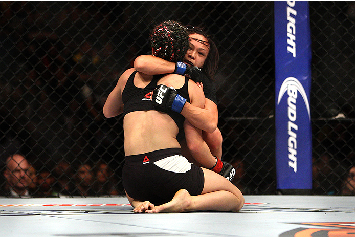 LAS VEGAS, NV - JULY 12: Angela Magana (front) and Michelle Waterson embrace after their women's strawweight bout during the Ultimate Fighter Finale inside MGM Grand Garden Arena on July 12, 2015 in Las Vegas, Nevada. (Photo by Mitch Viquez/Zuffa LLC/Zu