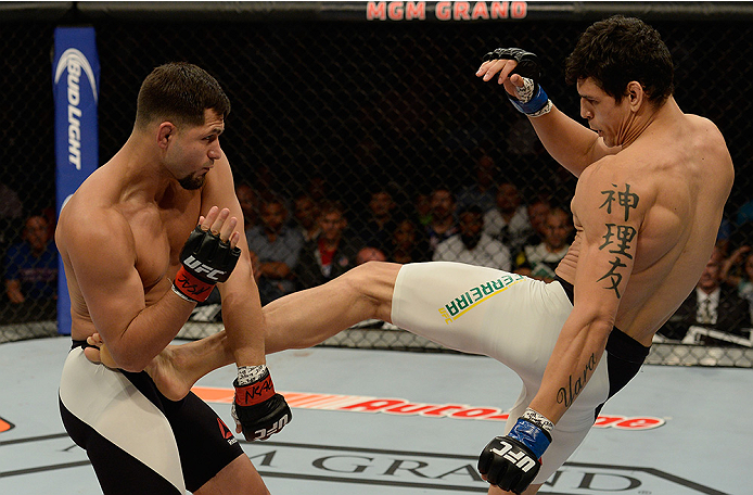 LAS VEGAS, NV - JULY 12: (R-L) Cezar Ferreira kicks Jorge Masvidal in their welterweight bout during the Ultimate Fighter Finale inside MGM Grand Garden Arena on July 12, 2015 in Las Vegas, Nevada. (Photo by Brandon Magnus/Zuffa LLC/Zuffa LLC via Getty