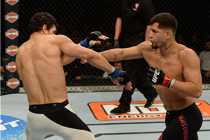 LAS VEGAS, NV - JULY 12: (R-L) Jorge Masvidal punches Cezar Ferreira in their welterweight bout during the Ultimate Fighter Finale inside MGM Grand Garden Arena on July 12, 2015 in Las Vegas, Nevada. (Photo by Brandon Magnus/Zuffa LLC/Zuffa LLC via Gett