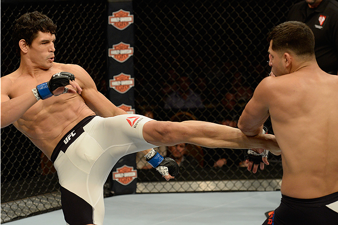 LAS VEGAS, NV - JULY 12: (L-R) Cezar Ferreira kicks Jorge Masvidal in their welterweight bout during the Ultimate Fighter Finale inside MGM Grand Garden Arena on July 12, 2015 in Las Vegas, Nevada. (Photo by Brandon Magnus/Zuffa LLC/Zuffa LLC via Getty