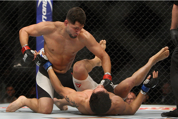 LAS VEGAS, NV - JULY 12: Jorge Masvidal (top) punches Cezar Ferreira in their welterweight bout during the Ultimate Fighter Finale inside MGM Grand Garden Arena on July 12, 2015 in Las Vegas, Nevada. (Photo by Mitch Viquez/Zuffa LLC/Zuffa LLC via Getty