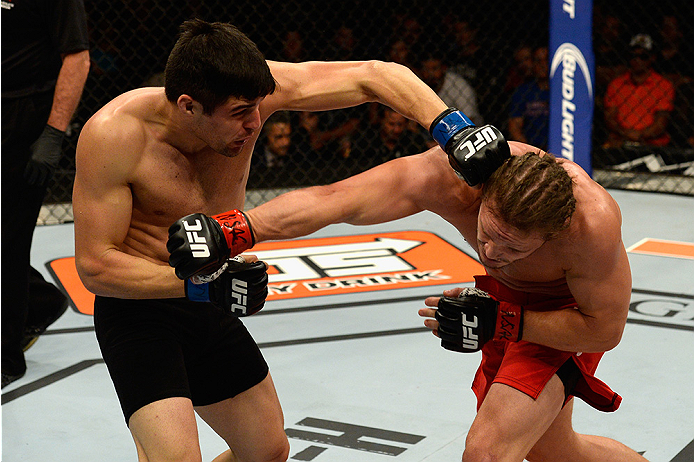 LAS VEGAS, NV - JULY 12: (L-R) Vicente Luque punches Michael Graves in their welterweight bout during the Ultimate Fighter Finale inside MGM Grand Garden Arena on July 12, 2015 in Las Vegas, Nevada. (Photo by Brandon Magnus/Zuffa LLC/Zuffa LLC via Getty