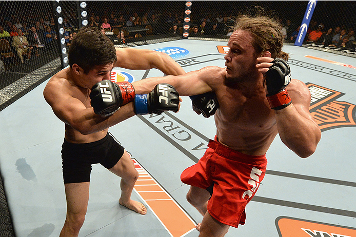 LAS VEGAS, NV - JULY 12: (R-L) Michael Graves punches Vicente Luque in their welterweight bout during the Ultimate Fighter Finale inside MGM Grand Garden Arena on July 12, 2015 in Las Vegas, Nevada. (Photo by Brandon Magnus/Zuffa LLC/Zuffa LLC via Getty