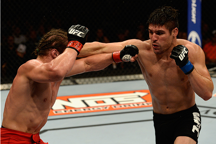 LAS VEGAS, NV - JULY 12: (R-L) Vicente Luque punches Michael Graves in their welterweight bout during the Ultimate Fighter Finale inside MGM Grand Garden Arena on July 12, 2015 in Las Vegas, Nevada. (Photo by Brandon Magnus/Zuffa LLC/Zuffa LLC via Getty