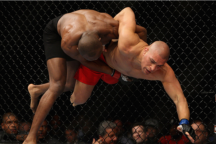 LAS VEGAS, NV - JULY 12: (L-R) Kamaru Usman takes down Hayder Hassan in their welterweight bout during the Ultimate Fighter Finale inside MGM Grand Garden Arena on July 12, 2015 in Las Vegas, Nevada. (Photo by Mitch Viquez/Zuffa LLC/Zuffa LLC via Getty