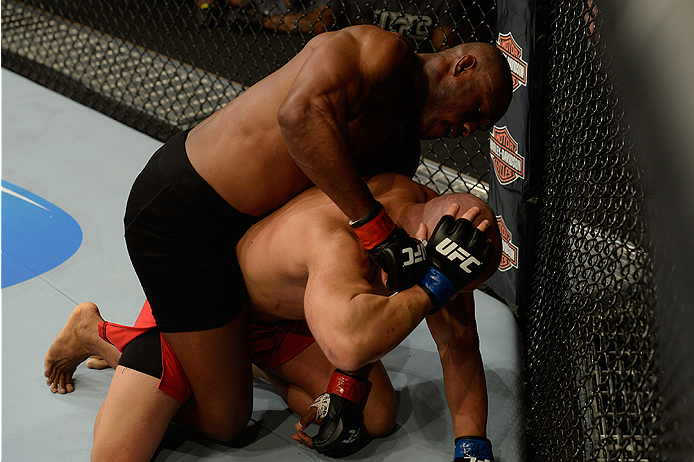 LAS VEGAS, NV - JULY 12: (Top) Kamaru Usman punches Hayder Hassan in their welterweight bout during the Ultimate Fighter Finale inside MGM Grand Garden Arena on July 12, 2015 in Las Vegas, Nevada. (Photo by Brandon Magnus/Zuffa LLC/Zuffa LLC via Getty I