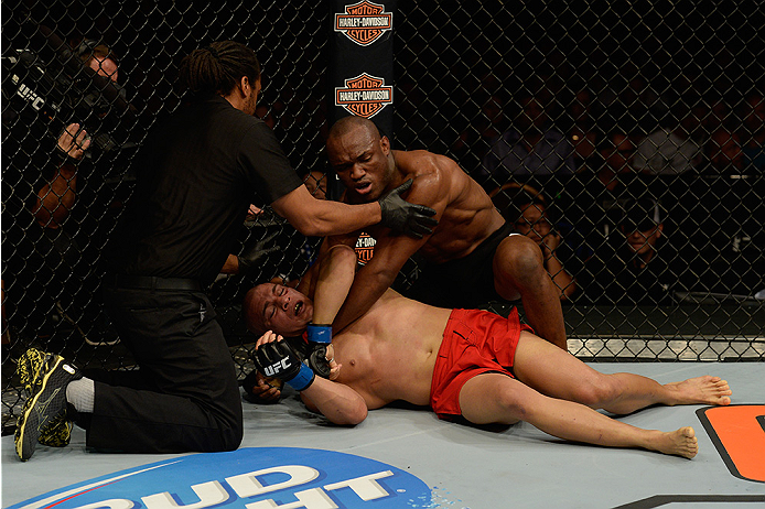 LAS VEGAS, NV - JULY 12: Referee Herb Dean stops fight between Kamaru Usman (top) and Hayder Hassan (bottom) during the Ultimate Fighter Finale inside MGM Grand Garden Arena on July 12, 2015 in Las Vegas, Nevada. (Photo by Brandon Magnus/Zuffa LLC/Zuffa