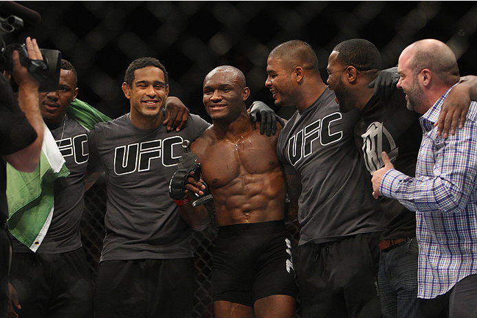 LAS VEGAS, NV - JULY 12: Kamaru Usman (center) celebrates with his teammates after defeating Hayder Hassan in their welterweight bout during the Ultimate Fighter Finale inside MGM Grand Garden Arena on July 12, 2015 in Las Vegas, Nevada. (Photo by Mitch