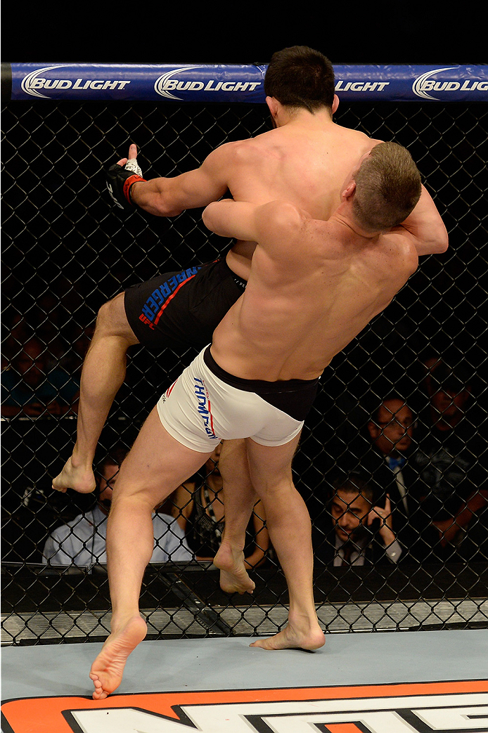 LAS VEGAS, NV - JULY 12: Stephen Thompson picks up Jake Ellenberger in their welterweight bout during the Ultimate Fighter Finale inside MGM Grand Garden Arena on July 12, 2015 in Las Vegas, Nevada. (Photo by Brandon Magnus/Zuffa LLC/Zuffa LLC via Getty