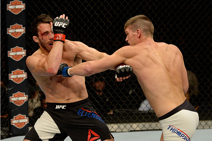 LAS VEGAS, NV - JULY 12: (R-L) Stephen Thompson punches Jake Ellenberger in their welterweight bout during the Ultimate Fighter Finale inside MGM Grand Garden Arena on July 12, 2015 in Las Vegas, Nevada. (Photo by Brandon Magnus/Zuffa LLC/Zuffa LLC via