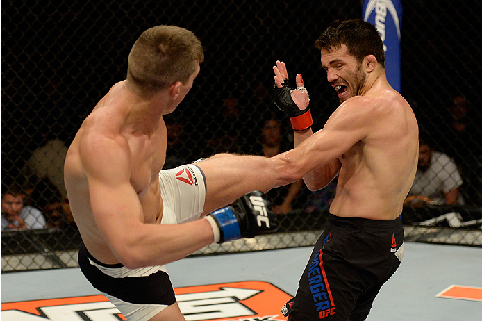 LAS VEGAS, NV - JULY 12: (L-R) Stephen Thompson kicks Jake Ellenberger in their welterweight bout during the Ultimate Fighter Finale inside MGM Grand Garden Arena on July 12, 2015 in Las Vegas, Nevada. (Photo by Brandon Magnus/Zuffa LLC/Zuffa LLC via Ge