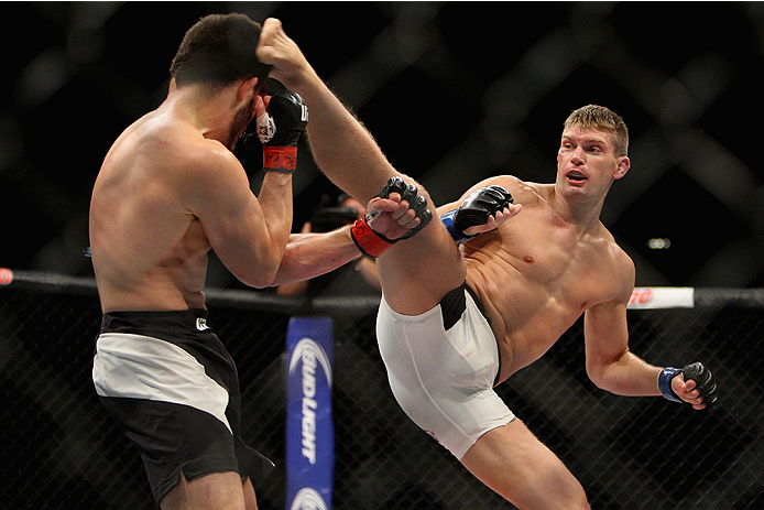 LAS VEGAS, NV - JULY 12: (R-L) Stephen Thompson kicks Jake Ellenberger in their welterweight bout during the Ultimate Fighter Finale inside MGM Grand Garden Arena on July 12, 2015 in Las Vegas, Nevada. (Photo by Mitch Viquez/Zuffa LLC/Zuffa LLC via Gett