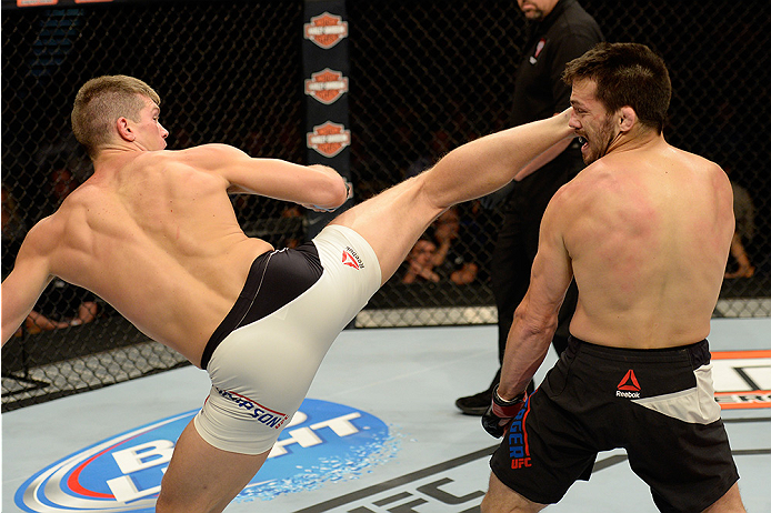 LAS VEGAS, NV - JULY 12: (L-R) Stephen Thompson kicks Jake Ellenberger in their welterweight bout during the Ultimate Fighter Finale inside MGM Grand Garden Arena on July 12, 2015 in Las Vegas, Nevada. (Photo by Brandon Magnus/Zuffa LLC/Zuffa LLC via Ge