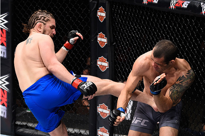 LAS VEGAS, NV - DECEMBER 11: (L-R) Chris Gruetzemacher kicks Abner Lloveras in their lightweight bout during the TUF Finale event inside The Chelsea at The Cosmopolitan of Las Vegas on December 11, 2015 in Las Vegas, Nevada. (Photo by Jeff Bottari/Zuffa