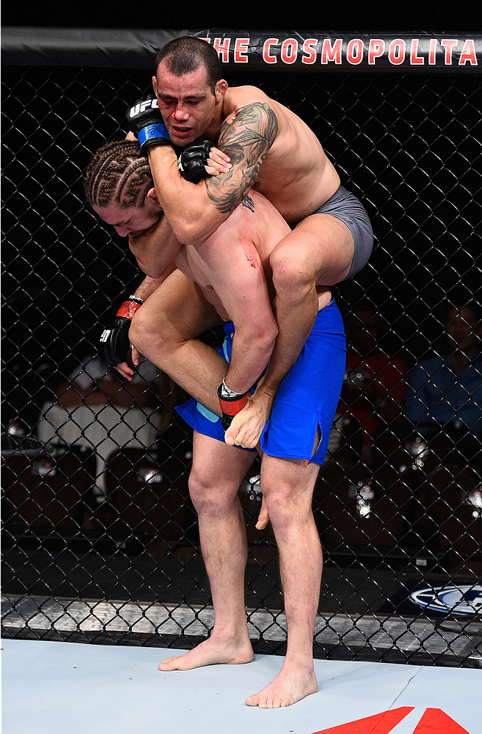 LAS VEGAS, NV - DECEMBER 11: Abner Lloveras (top) attempts to submit Chris Gruetzemacher (bottom) in their lightweight bout during the TUF Finale event inside The Chelsea at The Cosmopolitan of Las Vegas on December 11, 2015 in Las Vegas, Nevada. (Photo
