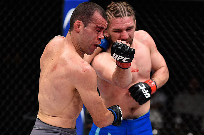 LAS VEGAS, NV - DECEMBER 11: (R-L) Chris Gruetzemacher punches Abner Lloveras in their lightweight bout during the TUF Finale event inside The Chelsea at The Cosmopolitan of Las Vegas on December 11, 2015 in Las Vegas, Nevada. (Photo by Jeff Bottari/Zuff