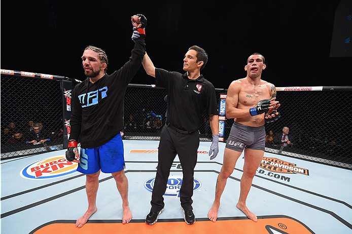 LAS VEGAS, NV - DECEMBER 11: Chris Gruetzemacher (left) reacts to his victory over Abner Lloveras (right) in their lightweight bout during the TUF Finale event inside The Chelsea at The Cosmopolitan of Las Vegas on December 11, 2015 in Las Vegas, Nevada.