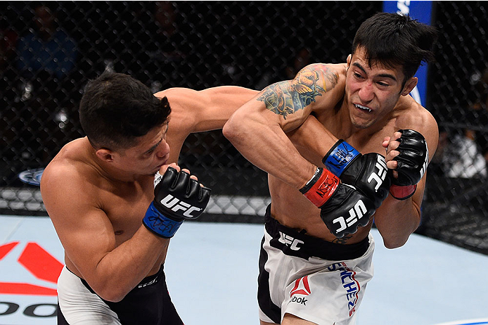 LAS VEGAS, NV - DECEMBER 11: (L-R) Geane Herrera punches Joby Sanchez in their flyweight bout during the TUF Finale event inside The Chelsea at The Cosmopolitan of Las Vegas on December 11, 2015 in Las Vegas, Nevada. (Photo by Jeff Bottari/Zuffa LLC/Zuff