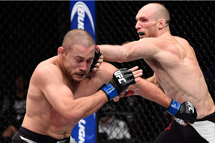 LAS VEGAS, NV - DECEMBER 11: (R-L) Ryan LaFlare punches Mike Pierce in their welterweight bout during the TUF Finale event inside The Chelsea at The Cosmopolitan of Las Vegas on December 11, 2015 in Las Vegas, Nevada. (Photo by Jeff Bottari/Zuffa LLC/Zuf