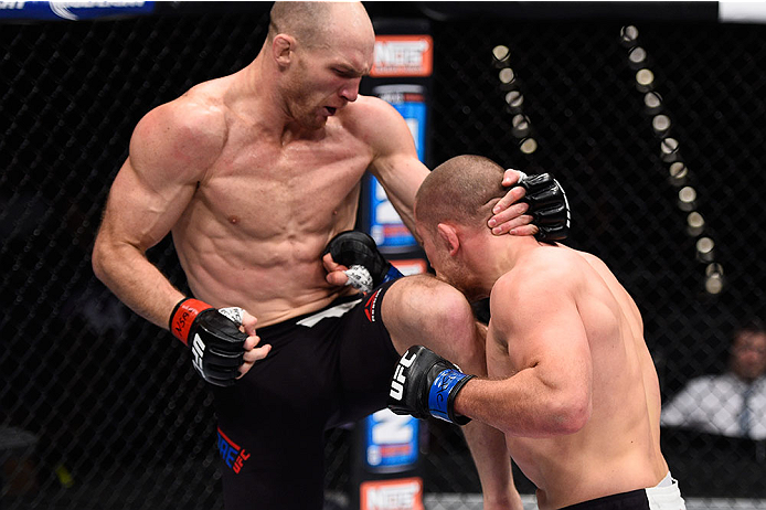 LAS VEGAS, NV - DECEMBER 11: (L-R) Ryan LaFlare knees Mike Pierce in their welterweight bout during the TUF Finale event inside The Chelsea at The Cosmopolitan of Las Vegas on December 11, 2015 in Las Vegas, Nevada. (Photo by Jeff Bottari/Zuffa LLC/Zuffa