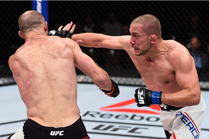 LAS VEGAS, NV - DECEMBER 11: (R-L) Mike Pierce punches Ryan LaFlare in their welterweight bout during the TUF Finale event inside The Chelsea at The Cosmopolitan of Las Vegas on December 11, 2015 in Las Vegas, Nevada. (Photo by Jeff Bottari/Zuffa LLC/Zuf