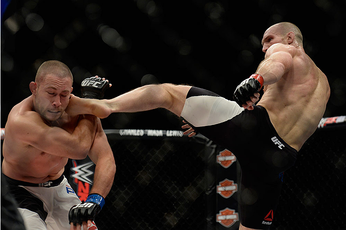 LAS VEGAS, NV - DECEMBER 11: (R-L) Ryan LaFlare kicks Mike Pierce in their welterweight bout during the TUF Finale event inside The Chelsea at The Cosmopolitan of Las Vegas on December 11, 2015 in Las Vegas, Nevada. (Photo by Brandon Magnus/Zuffa LLC/Zuf