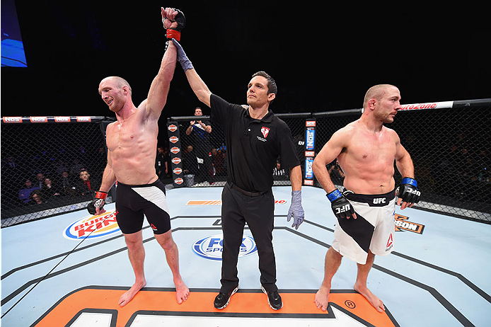 LAS VEGAS, NV - DECEMBER 11: Ryan LaFlare (left) is declared the winner over Mike Pierce (right) in their welterweight bout during the TUF Finale event inside The Chelsea at The Cosmopolitan of Las Vegas on December 11, 2015 in Las Vegas, Nevada. (Photo
