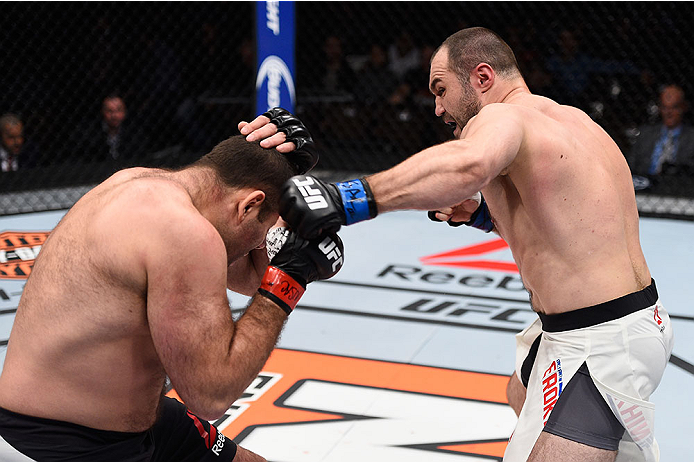 LAS VEGAS, NV - DECEMBER 11: (R-L) Konstantin Erokhin punches Gabriel Gonzaga in their heavyweight bout during the TUF Finale event inside The Chelsea at The Cosmopolitan of Las Vegas on December 11, 2015 in Las Vegas, Nevada. (Photo by Jeff Bottari/Zuff