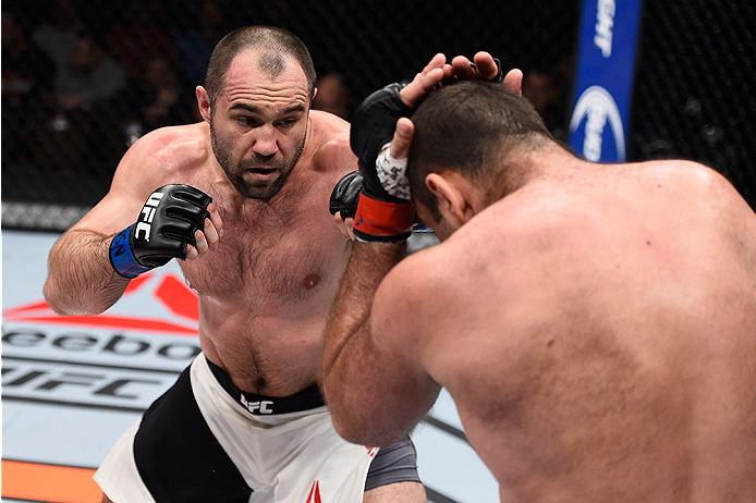 LAS VEGAS, NV - DECEMBER 11: (L-R) Konstantin Erokhin punches Gabriel Gonzaga in their heavyweight bout during the TUF Finale event inside The Chelsea at The Cosmopolitan of Las Vegas on December 11, 2015 in Las Vegas, Nevada. (Photo by Jeff Bottari/Zuff