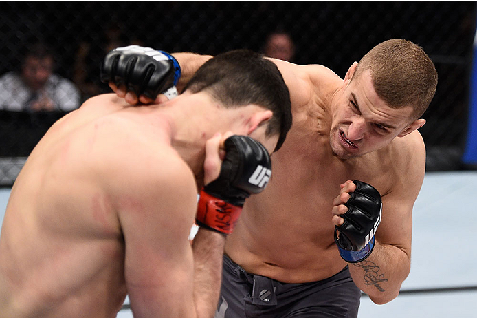 LAS VEGAS, NV - DECEMBER 11: (R-L) Marcin Wrzosek punches Julian Erosa in their lightweight bout during the TUF Finale event inside The Chelsea at The Cosmopolitan of Las Vegas on December 11, 2015 in Las Vegas, Nevada. (Photo by Jeff Bottari/Zuffa LLC/Z
