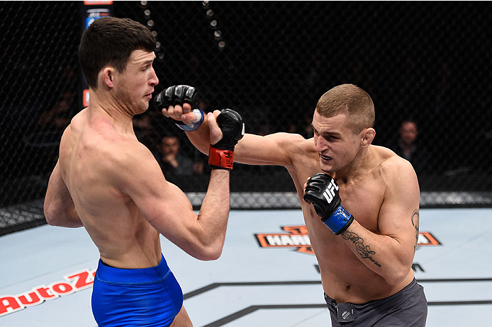 LAS VEGAS, NV - DECEMBER 11: (R-L) Marcin Wrzosek punches Julian Erosa in their lightweight bout during the TUF Finale event inside The Chelsea at The Cosmopolitan of Las Vegas on December 11, 2015 in Las Vegas, Nevada. (Photo by Jeff Bottari/Zuffa LLC/Z