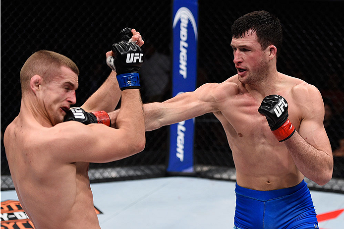 LAS VEGAS, NV - DECEMBER 11: (R-L) Julian Erosa punches Marcin Wrzosek in their lightweight bout during the TUF Finale event inside The Chelsea at The Cosmopolitan of Las Vegas on December 11, 2015 in Las Vegas, Nevada. (Photo by Jeff Bottari/Zuffa LLC/Z