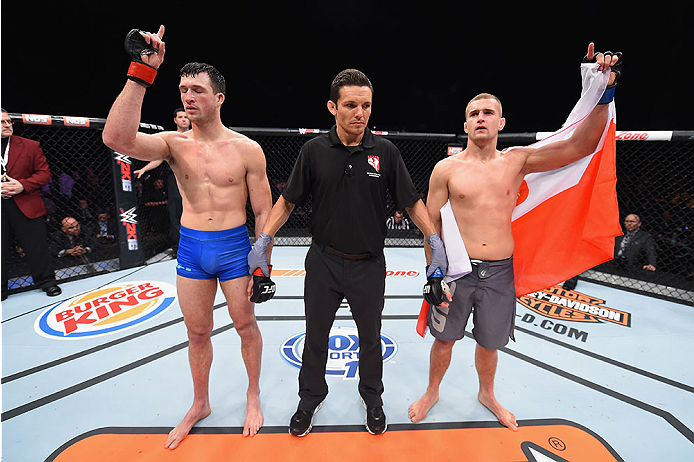 LAS VEGAS, NV - DECEMBER 11: Julian Erosa (left) and Marcin Wrzosek (right) await the decision in their lightweight bout during the TUF Finale event inside The Chelsea at The Cosmopolitan of Las Vegas on December 11, 2015 in Las Vegas, Nevada. (Photo by