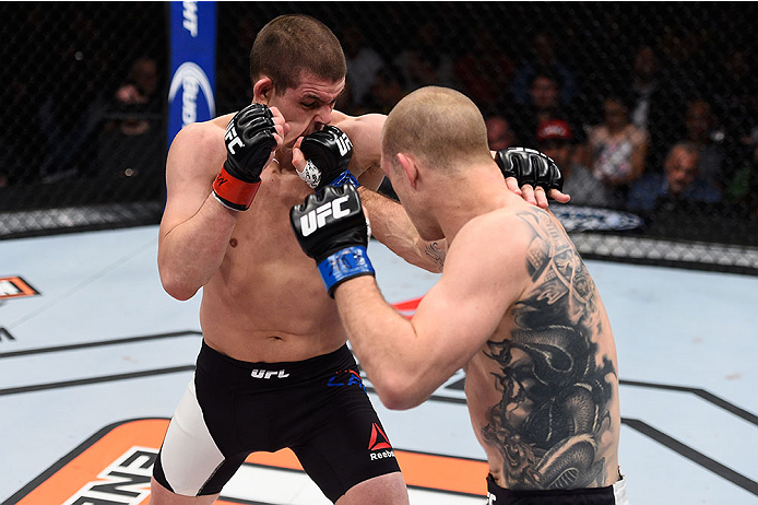 LAS VEGAS, NV - DECEMBER 11: (R-L) Evan Dunham punches Joe Lauzon in their lightweight bout during the TUF Finale event inside The Chelsea at The Cosmopolitan of Las Vegas on December 11, 2015 in Las Vegas, Nevada. (Photo by Jeff Bottari/Zuffa LLC/Zuffa