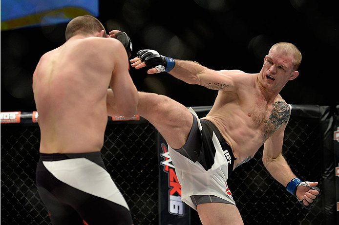 LAS VEGAS, NV - DECEMBER 11: (R-L) Evan Dunham kicks Joe Lauzon in their lightweight bout during the TUF Finale event inside The Chelsea at The Cosmopolitan of Las Vegas on December 11, 2015 in Las Vegas, Nevada. (Photo by Brandon Magnus/Zuffa LLC/Zuffa