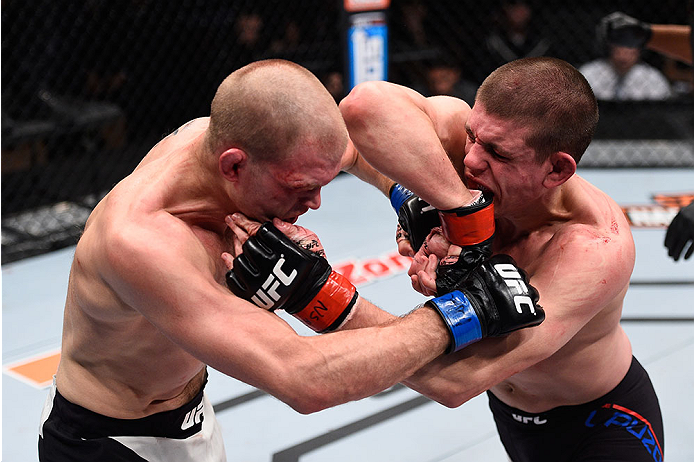 LAS VEGAS, NV - DECEMBER 11: (R-L) Joe Lauzon elbows Evan Dunham in their lightweight bout during the TUF Finale event inside The Chelsea at The Cosmopolitan of Las Vegas on December 11, 2015 in Las Vegas, Nevada. (Photo by Jeff Bottari/Zuffa LLC/Zuffa L