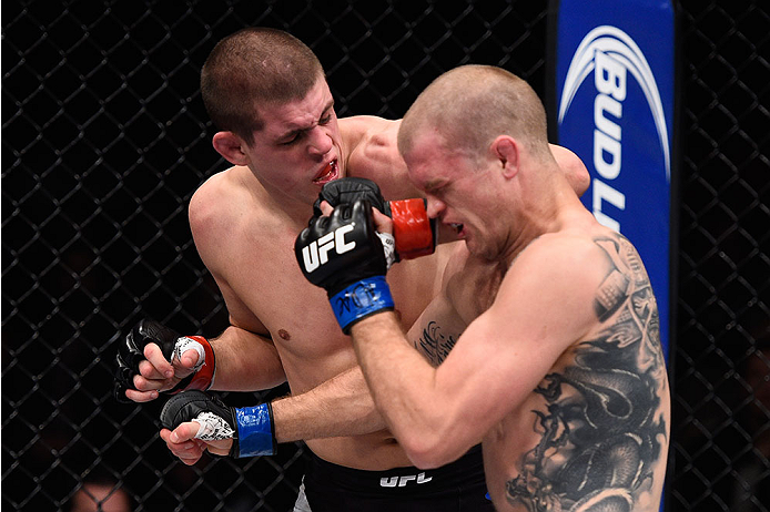 LAS VEGAS, NV - DECEMBER 11: (L-R) Joe Lauzon elbows Evan Dunham in their lightweight bout during the TUF Finale event inside The Chelsea at The Cosmopolitan of Las Vegas on December 11, 2015 in Las Vegas, Nevada. (Photo by Jeff Bottari/Zuffa LLC/Zuffa L