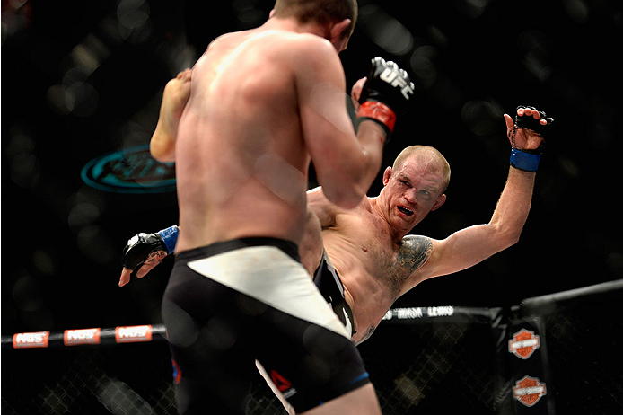 LAS VEGAS, NV - DECEMBER 11: Evan Dunham kicks Joe Lauzon (black trunks) in their lightweight bout during the TUF Finale event inside The Chelsea at The Cosmopolitan of Las Vegas on December 11, 2015 in Las Vegas, Nevada. (Photo by Brandon Magnus/Zuffa L