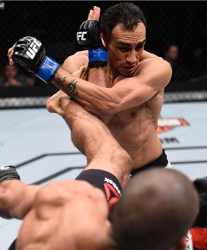 LAS VEGAS, NV - DECEMBER 11: Edson Barboza (bottom) kicks Tony Ferguson in their lightweight bout during the TUF Finale event inside The Chelsea at The Cosmopolitan of Las Vegas on December 11, 2015 in Las Vegas, Nevada. (Photo by Jeff Bottari/Zuffa LLC/