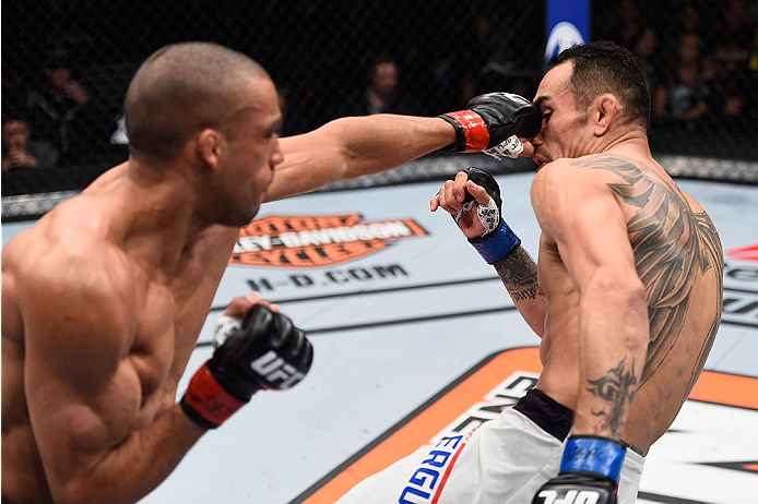 LAS VEGAS, NV - DECEMBER 11: (L-R) Edson Barboza punches Tony Ferguson in their lightweight bout during the TUF Finale event inside The Chelsea at The Cosmopolitan of Las Vegas on December 11, 2015 in Las Vegas, Nevada. (Photo by Jeff Bottari/Zuffa LLC/Z