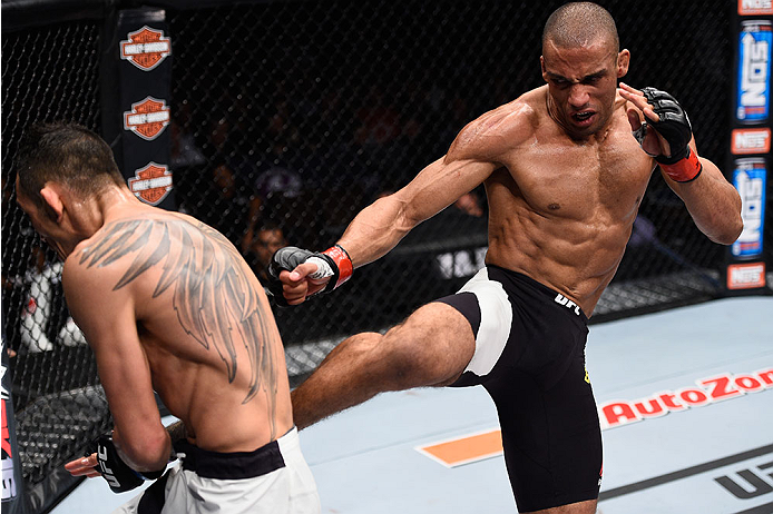 LAS VEGAS, NV - DECEMBER 11: (R-L) Edson Barboza kicks Tony Ferguson in their lightweight bout during the TUF Finale event inside The Chelsea at The Cosmopolitan of Las Vegas on December 11, 2015 in Las Vegas, Nevada. (Photo by Jeff Bottari/Zuffa LLC/Zuf