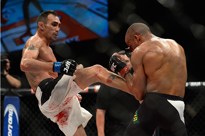 LAS VEGAS, NV - DECEMBER 11: (L-R) Tony Ferguson kicks Edson Barboza in their lightweight bout during the TUF Finale event inside The Chelsea at The Cosmopolitan of Las Vegas on December 11, 2015 in Las Vegas, Nevada. (Photo by Brandon Magnus/Zuffa LLC/Z
