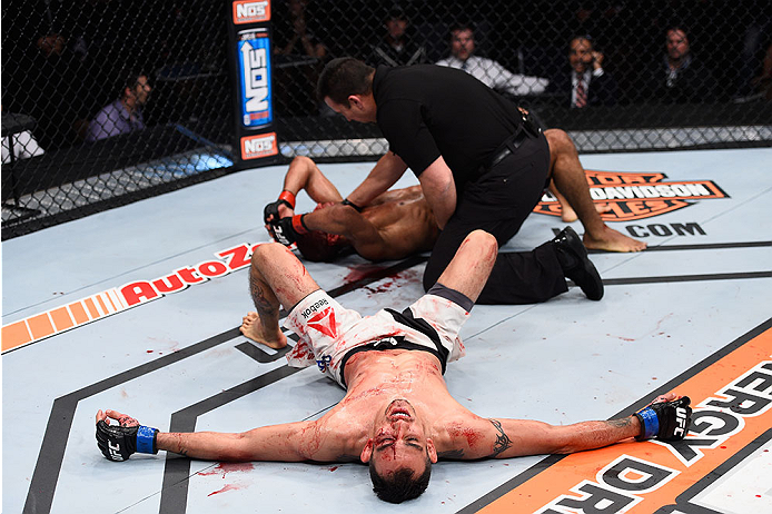 LAS VEGAS, NV - DECEMBER 11: Tony Ferguson (bottom) reacts to his victory over Edson Barboza in their lightweight bout during the TUF Finale event inside The Chelsea at The Cosmopolitan of Las Vegas on December 11, 2015 in Las Vegas, Nevada. (Photo by Je