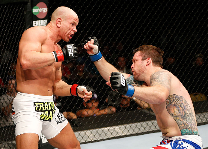 QUEBEC CITY, CANADA - APRIL 16: Sean O'Connell (R) falls to the canvas after a right hand by Ryan Jimmo in their light heavyweight fight during the TUF Nations Finale at Colisee Pepsi on April 16, 2014 in Quebec City, Quebec, Canada. (Photo by Josh Hedge